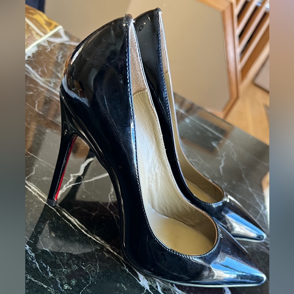 Used Christian Louboutin Leather Pointed shoes. bag and extra heel caps. No box.